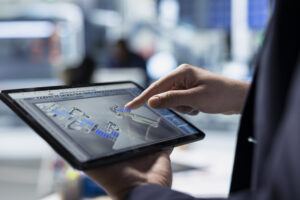 solar factory expert monitors machinery performance on a production line