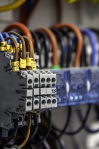 electrical panel with fuses and contactors, close up.